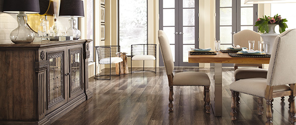 Family playing games in a living room with a hardwood floor